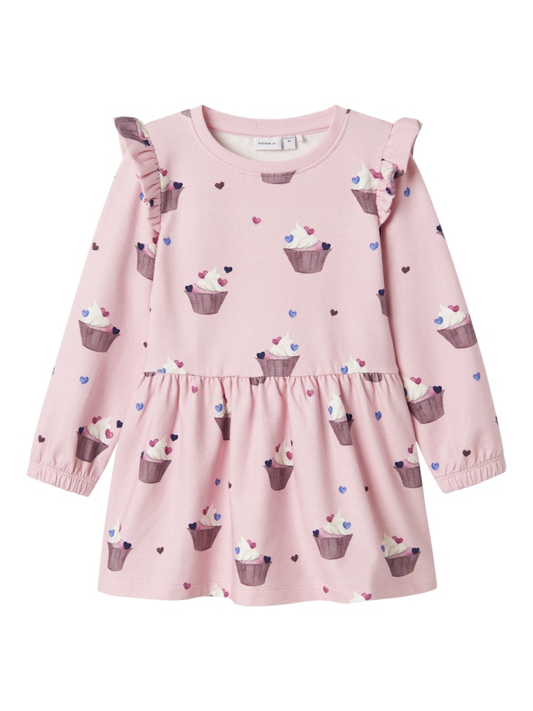 Pink dress with cupcake pattern on a pink background