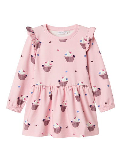 Pink dress with cupcake pattern on a pink background